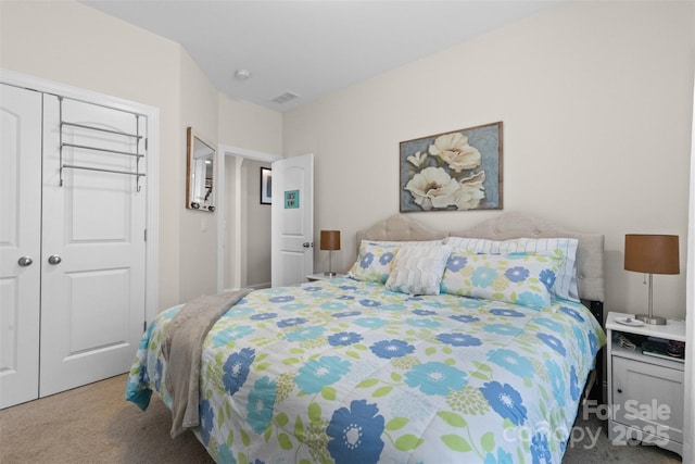 bedroom with a closet, carpet, and visible vents