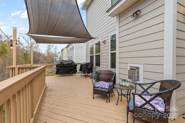 wooden terrace featuring area for grilling