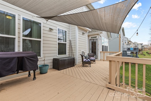 wooden terrace with area for grilling