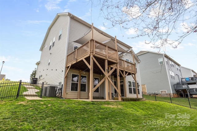 back of house with a lawn, a patio, a wooden deck, and fence