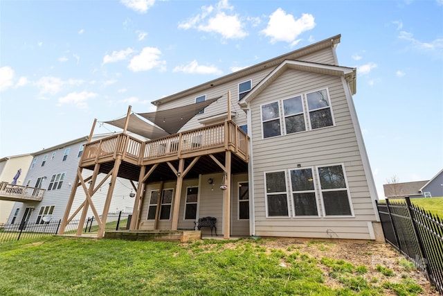 back of house with a lawn, a fenced backyard, and a wooden deck