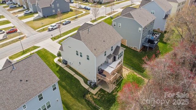 birds eye view of property with a residential view