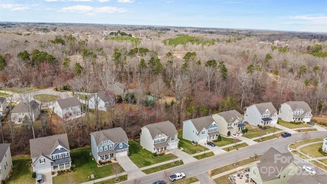 aerial view featuring a residential view and a view of trees