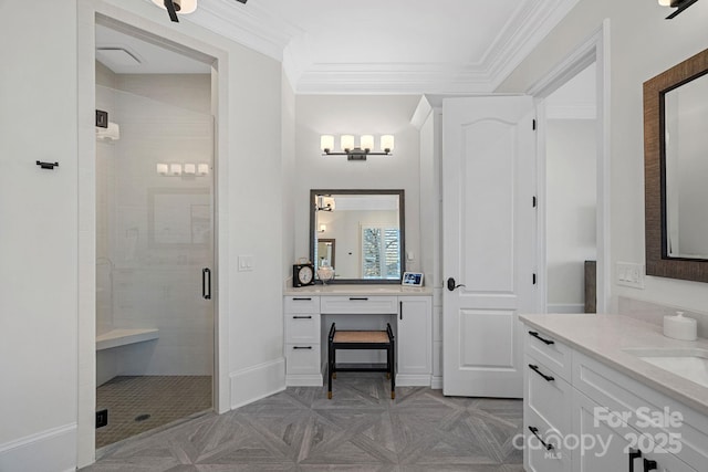 bathroom featuring a stall shower, vanity, and crown molding