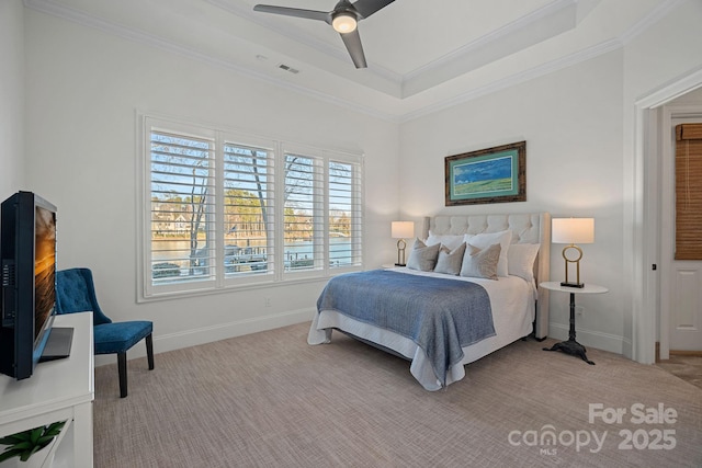 bedroom with light carpet, visible vents, baseboards, ornamental molding, and a tray ceiling