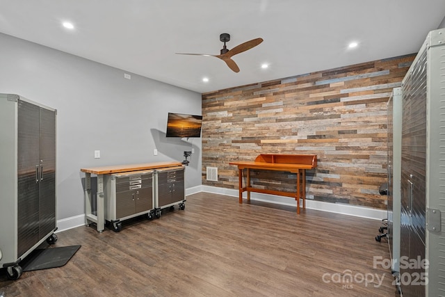 interior space with baseboards, visible vents, a ceiling fan, wood finished floors, and recessed lighting