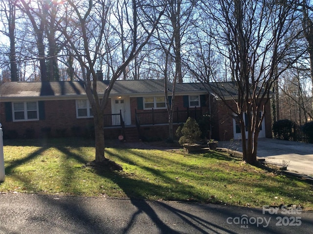 ranch-style home with a front lawn