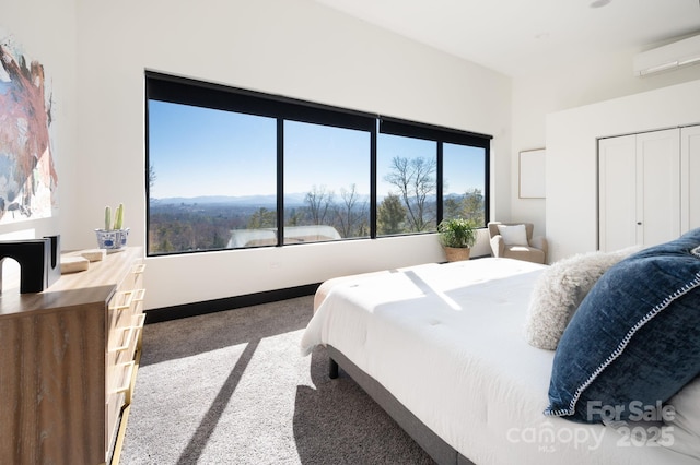 carpeted bedroom with multiple windows, a wall unit AC, and baseboards