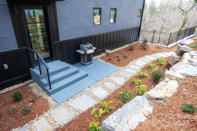 view of patio with grilling area and fence