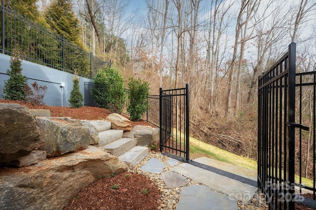 view of gate featuring fence