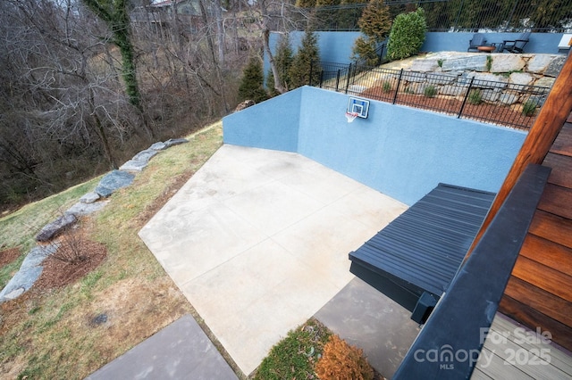 exterior space with a patio and a fenced backyard