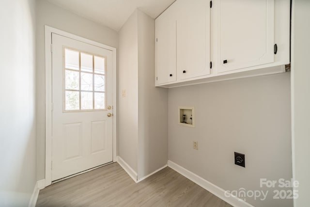 washroom featuring hookup for a washing machine, hookup for an electric dryer, baseboards, light wood-type flooring, and cabinet space