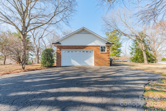 view of property exterior with brick siding