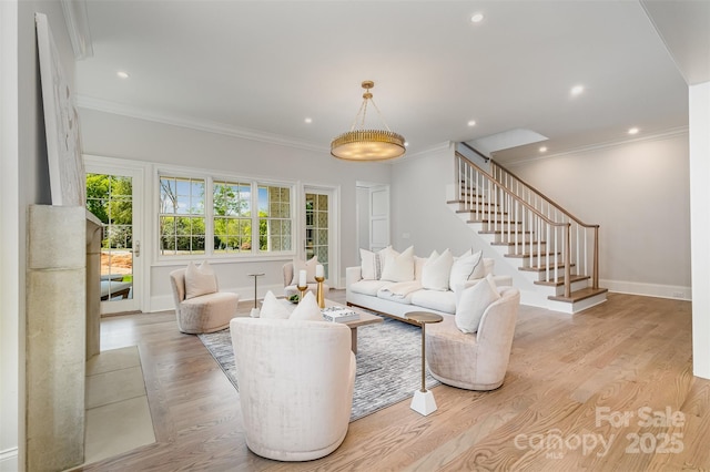 living room featuring crown molding and light hardwood / wood-style flooring