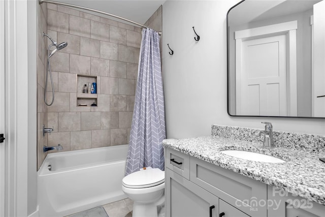 full bathroom featuring tile patterned flooring, vanity, toilet, and shower / bathtub combination with curtain