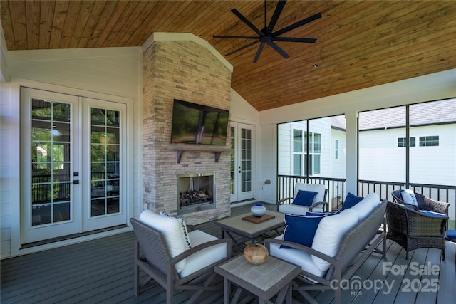 sunroom / solarium featuring wood ceiling, vaulted ceiling, an outdoor brick fireplace, and french doors