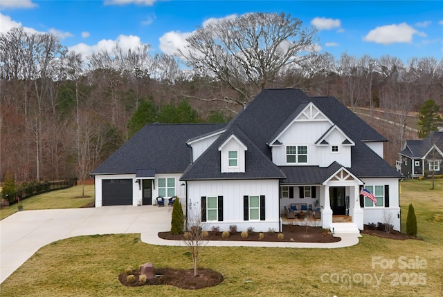 129 Ryleigh Dan Pl, Mooresville, NC 28115 - view of front facade with driveway, covered porch, board and batten siding, and a front yard
