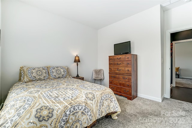 carpeted bedroom with baseboards