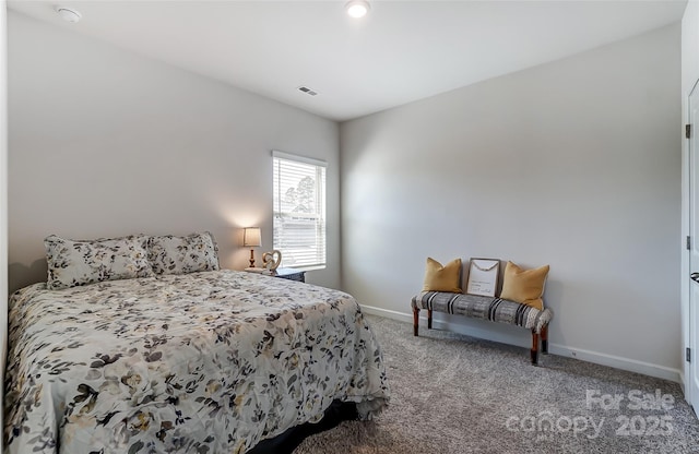 bedroom with carpet flooring, visible vents, and baseboards