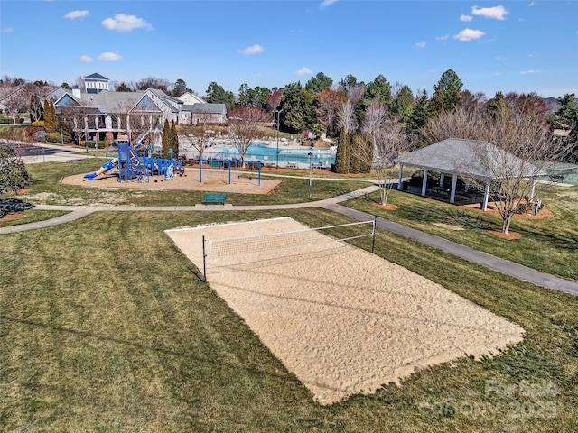 view of property's community featuring playground community, a lawn, a gazebo, and volleyball court