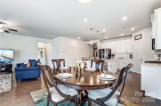 dining area featuring ceiling fan, visible vents, wood finished floors, and recessed lighting