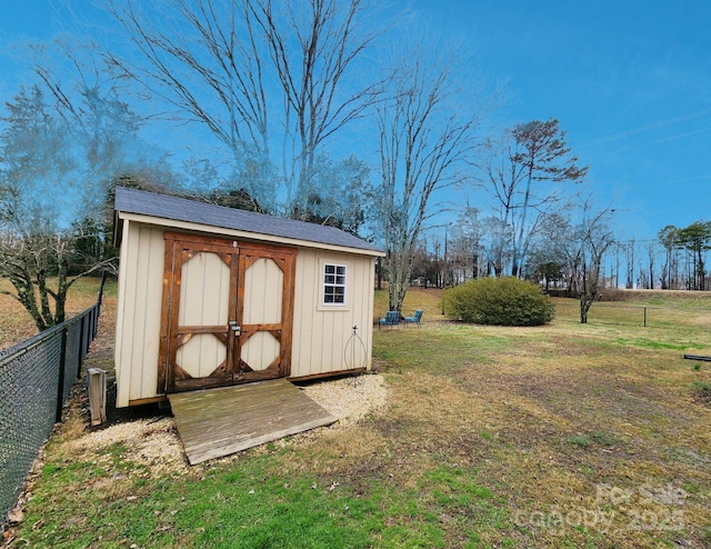 view of outbuilding featuring a lawn