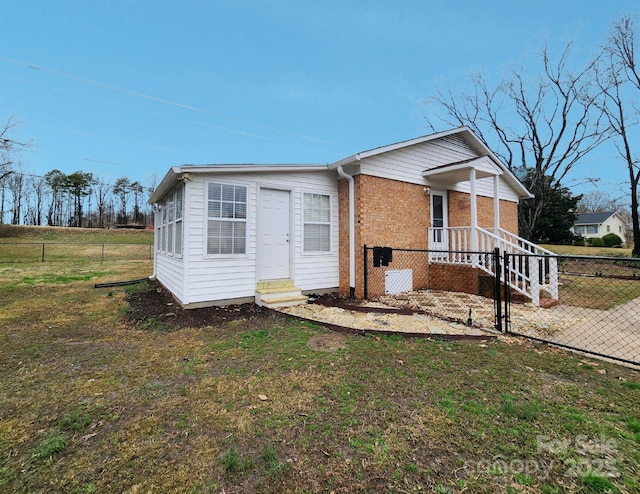 view of front of home with a front lawn