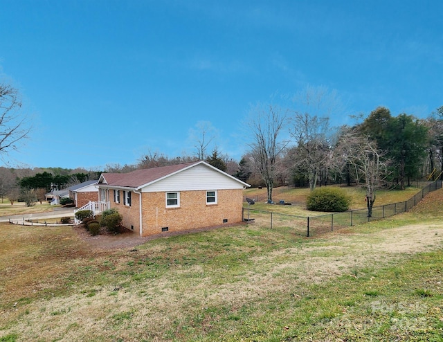 view of side of home featuring a lawn