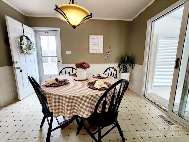 dining area featuring ornamental molding