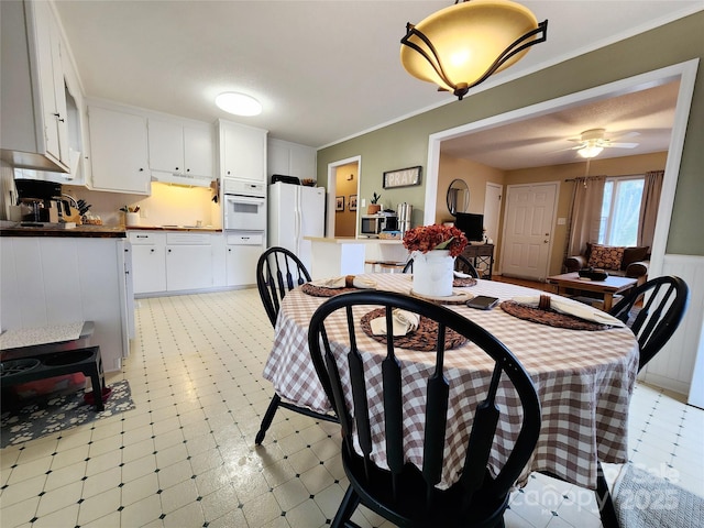 dining room featuring ornamental molding and ceiling fan