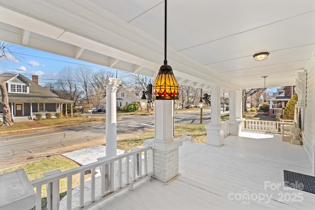 wooden terrace featuring a porch