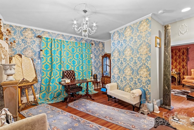 sitting room with arched walkways, a chandelier, wood finished floors, and ornamental molding