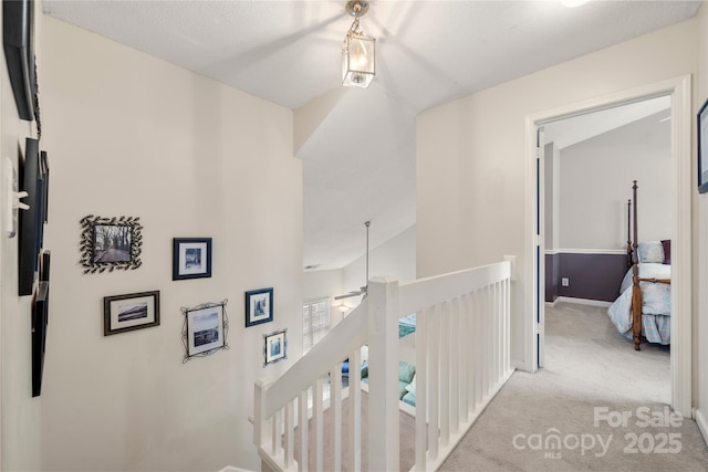 hallway featuring light carpet