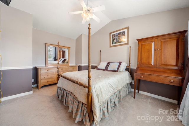 carpeted bedroom with lofted ceiling and ceiling fan