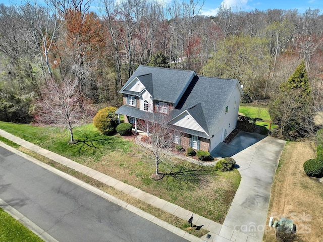 drone / aerial view with a view of trees