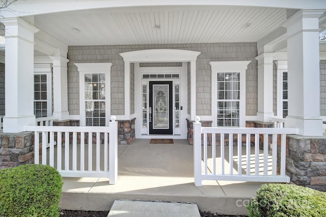 property entrance with covered porch