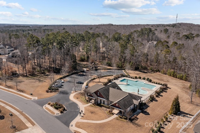 birds eye view of property with a forest view