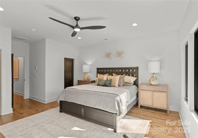 bedroom featuring light wood-type flooring, ceiling fan, baseboards, and recessed lighting