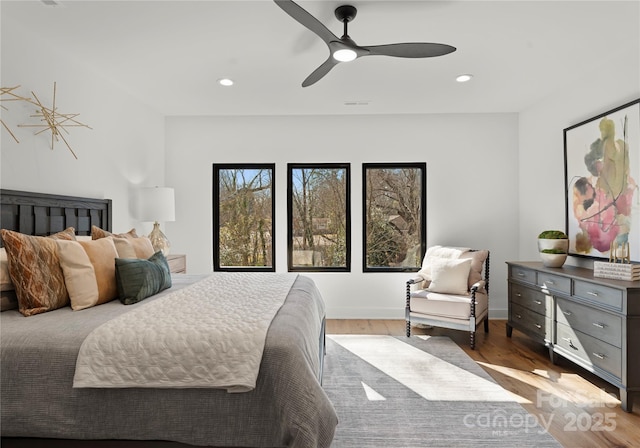 bedroom with ceiling fan, visible vents, wood finished floors, and recessed lighting
