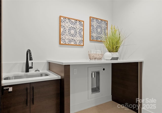 laundry area with laundry area and a sink