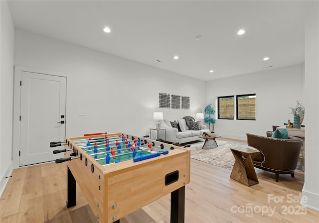 rec room featuring light wood-style flooring and recessed lighting