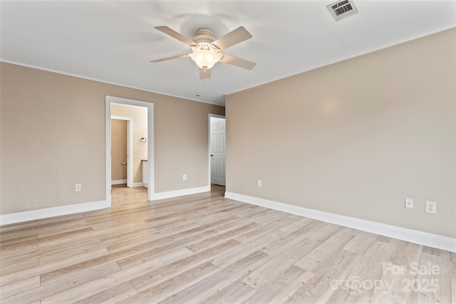 unfurnished room with ceiling fan, ornamental molding, and light hardwood / wood-style floors