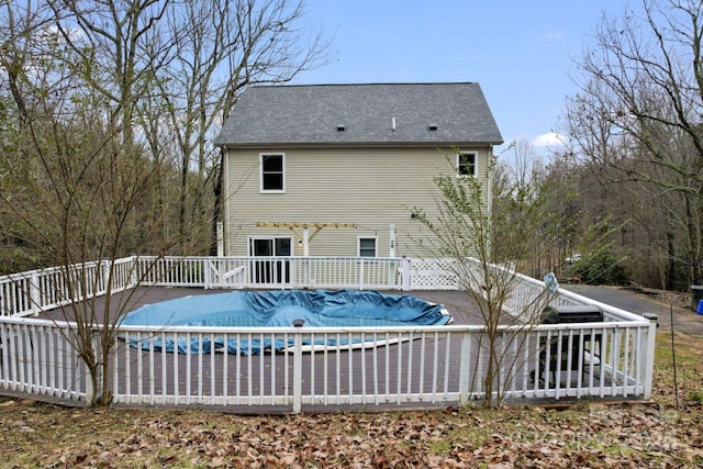 view of swimming pool featuring a deck