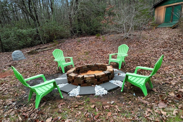 view of yard with a fire pit