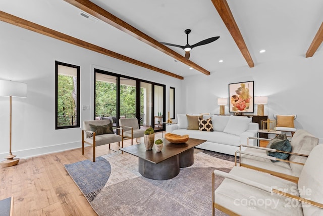 living room with baseboards, recessed lighting, a ceiling fan, beam ceiling, and hardwood / wood-style flooring