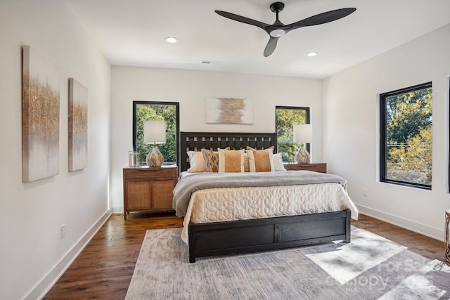 bedroom featuring baseboards, recessed lighting, and wood finished floors