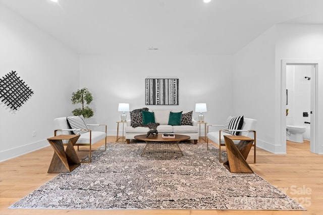 living room with wood finished floors and baseboards