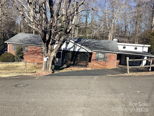 view of front of home with a carport