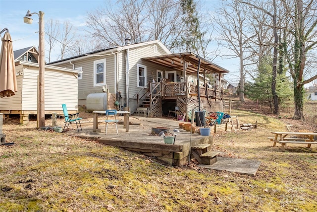 rear view of house with a deck