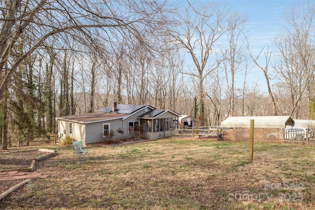 view of yard featuring a sunroom